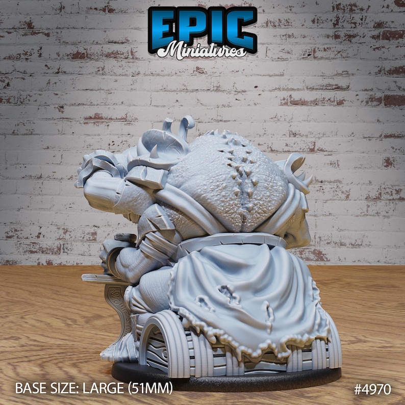 May include: A gray, detailed miniature of a goblin sitting on a throne with a large, tattered cape. The miniature is on a round base with the text "BASE SIZE: LARGE (51MM)" and "#4970" printed on the base.