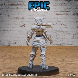 May include: A grey 3D printed miniature of a female figure with horns, wearing armor and a skirt. The figure is standing on a black base. BASE SIZE: MEDIUM (25.5MM) #4957