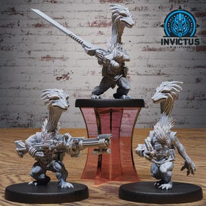 May include: Three unpainted gray resin miniature figures of reptilian creatures with long necks and textured skin. One figure holds a long sword, while the others carry futuristic rifles. Each stands on a black circular base with a logo above.