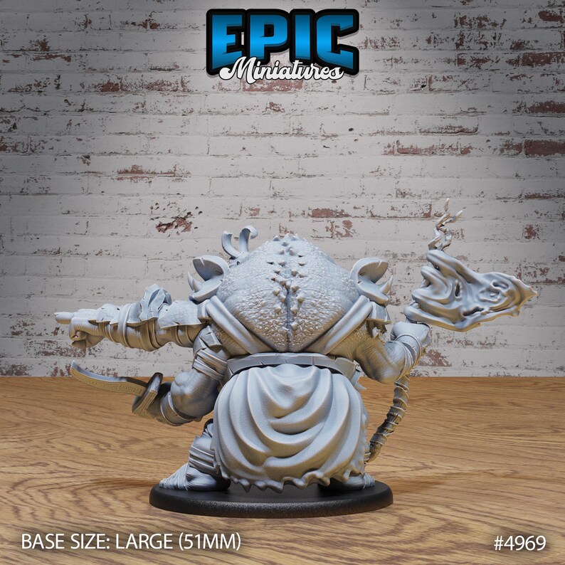 May include: A gray, detailed miniature of a goblin warrior holding a weapon and a shield. The miniature is standing on a round base. The base is labeled "BASE SIZE: LARGE (51MM)" and "#4969".
