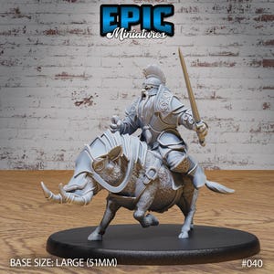 May include: A grey plastic miniature of a dwarf riding a boar, both wearing armour. The dwarf is holding a sword and has a beard. The boar has a saddle and a bridle. The miniature is on a round base. BASE SIZE: LARGE (51MM) #040