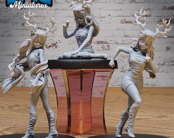 May include: Three gray painted figurines of women with antlers and flowing hair. The women are wearing short dresses and boots. The figurines are posed in different positions. The word "EPIC" is visible in the background.