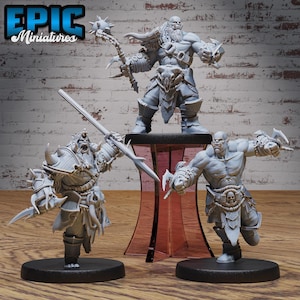 May include: Three unpainted miniature figures of orcs, each with different weapons and armour. The orcs are standing on black bases. The figures are from the Epic Miniatures brand.