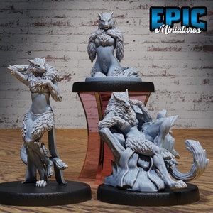May include: Three gray painted resin figurines of a wolf-like creature in various poses. The creature has a human-like body with a wolf head and tail. The figurines are on black bases. The text "EPIC Miniatures" is visible in the upper right corner of the image.