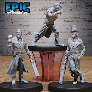 May include: Three gray resin miniature figures on circular bases. One figure holds a lantern and a long firearm, another uses a magnifying glass, and the third wears a top hat while holding a long firearm. The text EPIC Miniatures is visible.