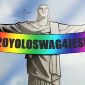 May include: A statue of Jesus Christ with outstretched arms holding a rainbow banner with the text "420YOLOSWAG4JESUS".