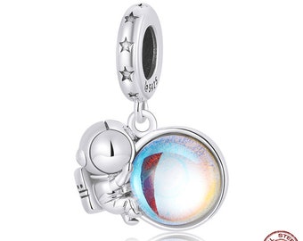 Charm pendant silver 925, cute little astronaut with the shimmering moon