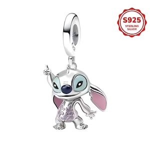 May include: A silver charm featuring a cartoon character with large ears, blue eyes, and a dark blue nose. The charm has pink accents on the ears and a decorative design on the chest. The charm is marked "S925 Sterling Silver".