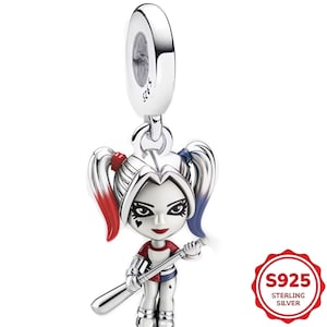 May include: A sterling silver charm featuring a cartoon character with red and blue pigtails, holding a baseball bat. The charm has a red, white, and blue color scheme and is marked with "S925 STERLING S8.VER".