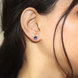 Handcrafted gold earrings with deep blue cubic zirconia and top white CZ crystals – subtle sparkle for modern women.
 handcrafted earrings, CZ jewelry, gold plated, minimal earrings, elegant gift