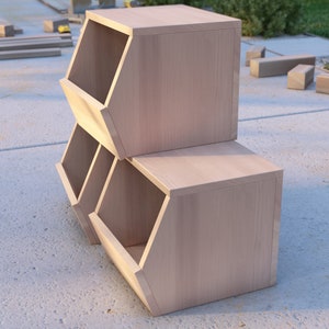 May include: A set of two wooden storage bins with a light brown finish. The bins are stacked on top of each other and have a hexagonal shape.