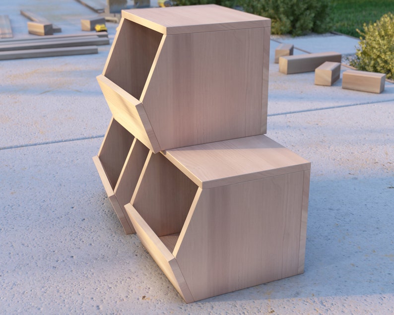 May include: A set of two wooden storage bins with a light brown finish. The bins are stacked on top of each other and have a hexagonal shape.