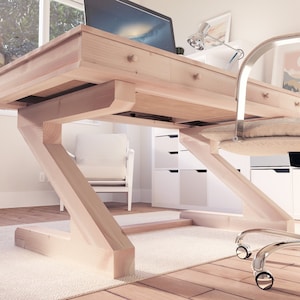Puede incluir: Un escritorio de madera clara con una base en forma de Z y cajones. El escritorio est&aacute; en una habitaci&oacute;n con una silla blanca y una c&oacute;moda blanca.
