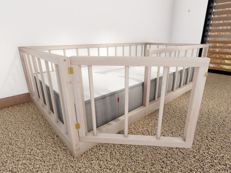 May include: A white wooden playpen with a gate that opens and closes. The playpen is on a beige carpet.