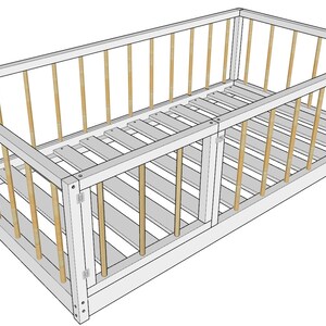 May include: White wooden crib with a white slatted mattress and brown wooden rails. The crib has a door on one side.