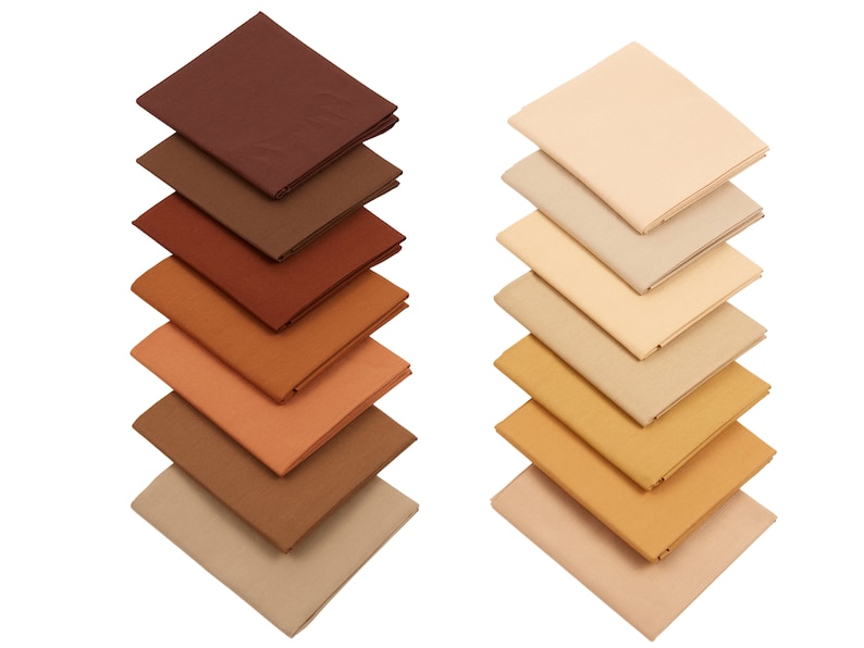 May include: A stack of eight fabric squares in shades of brown and beige. The squares are arranged in a gradient from dark brown to light beige.