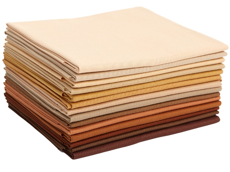 May include: A stack of 18 fabric squares in various shades of brown, beige, and cream. The fabric is a soft, natural cotton blend.