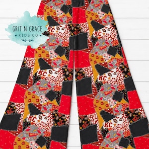 May include: Wide-leg pants featuring a patchwork design with red, black, and gold colors. The pattern includes footballs, the letters KC, leopard print, and pennants. The waistband is elasticized, and the fabric displays a variety of geometric shapes.