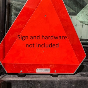 May include: Red triangular sign with the text "Sign and hardware not included".
