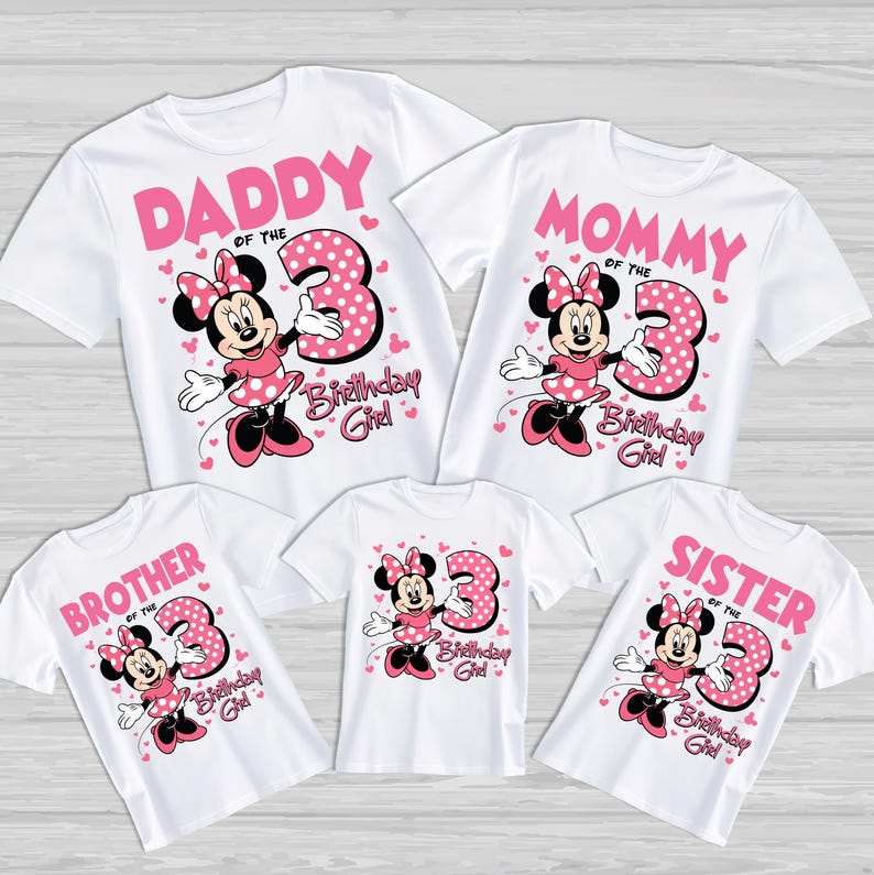 May include: White t-shirts with pink graphics featuring Minnie Mouse and the number 3. The shirts are labeled "Daddy", "Mommy", "Brother", "Sister", and "Birthday Girl". The Minnie Mouse design includes a polka-dot dress and bow.