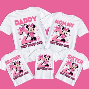 May include: White t-shirts with pink Minnie Mouse graphics and the number 2. The shirts display the words "Daddy," "Mommy," "Brother," "Birthday Girl," and "Sister," with "Birthday Girl" at the bottom.