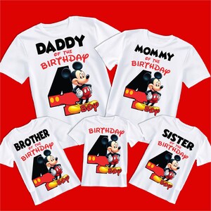May include: Four white t-shirts with a Mickey Mouse design and the text "Daddy of the Birthday", "Mommy of the Birthday", "Brother of the Birthday", and "Sister of the Birthday".