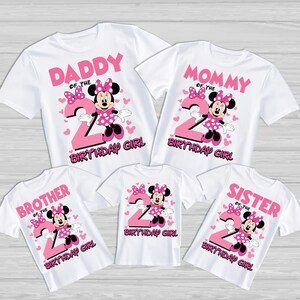 May include: White t-shirts with pink Minnie Mouse graphics and the number 2. The shirts are labelled "Daddy", "Mommy", "Brother", "Sister", and "Birthday Girl". The design includes hearts and bows.