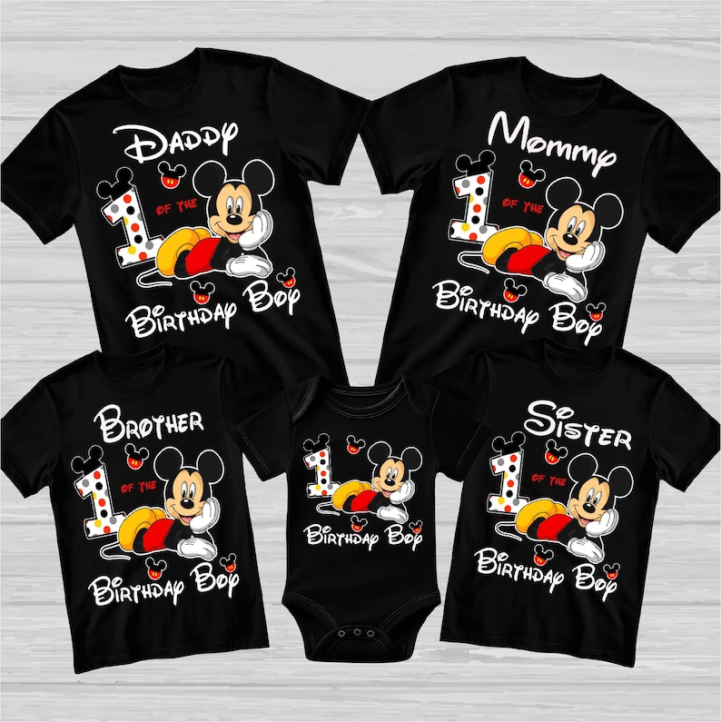 May include: Black family birthday shirts and a onesie featuring Mickey Mouse. The shirts read "Daddy", "Mommy", "Brother", and "Sister", with "1 of the Birthday Boy" and Mickey Mouse graphics. The onesie also has a Mickey Mouse graphic.