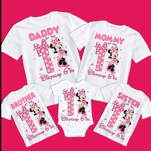 May include: White t-shirts and a onesie with pink graphics. Each shirt features a Minnie Mouse design with the text "Daddy", "Mommy", "Brother", and "Sister" above the number "1" and "Birthday Girl".