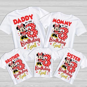 May include: White t-shirts featuring Minnie Mouse and the text "Daddy," "Mommy," "Brother," "Sister," and "Birthday Girl." Each shirt has a large red number "3" with polka dots. A family-themed design for a birthday celebration.