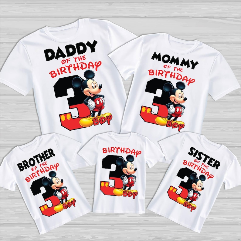 May include: White t-shirts with Mickey Mouse graphics for a family birthday. Each shirt has a different title: "Daddy", "Mommy", "Brother", "Sister", and "Birthday". The number "3" is featured prominently, along with the word "BOY".