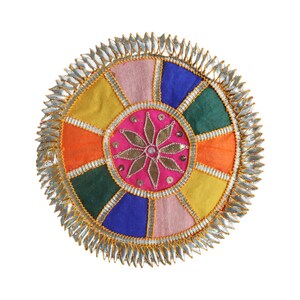 May include: A colorful, circular decorative item with a segmented design. The center features a pink circle with a gold floral design and sequins. The segments are various colors, including yellow, orange, green, blue, and pink, with a silver trim.
