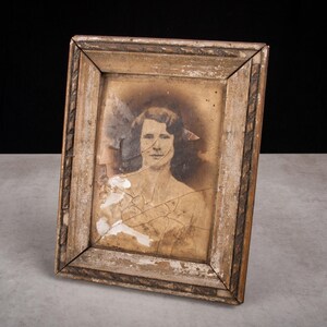 old black and white photo in a frame vintage woman portrait unique