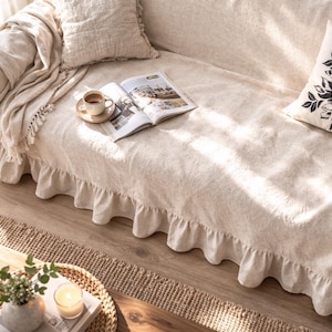 Beige sofa cover with a ruffled skirt