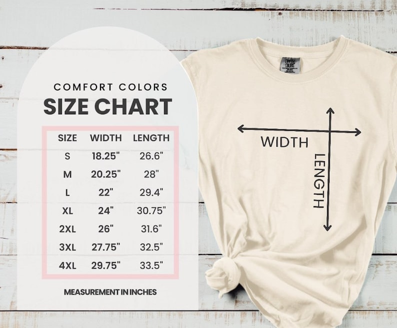 May include: Cream-coloured t-shirt with a size chart graphic. The chart displays measurements in inches for sizes S through 4XL, including width and length. The shirt has a crew neck and a knotted hem.
