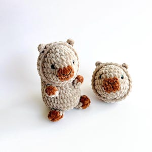 May include: A set of three ceramic mugs with a speckled, matte finish. The mugs are in shades of cream, light gray, and dark gray. Each mug has a simple, minimalist design, perfect for coffee or tea.