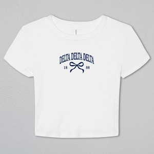 Delta Delta Delta Tied Together Baby Tee | Delta Delta Delta Apparel | Sorority Merch