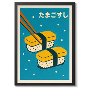 May include: A framed print featuring two pieces of sushi with yellow egg and black seaweed on a blue background. The Japanese text "tamago sushi" is at the top, with orange chopsticks above the sushi.
