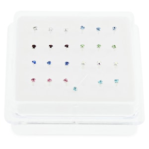 May include: A clear plastic box containing 20 silver nose rings with various colored rhinestones. The rhinestones are in shades of blue, green, red, pink, and clear.