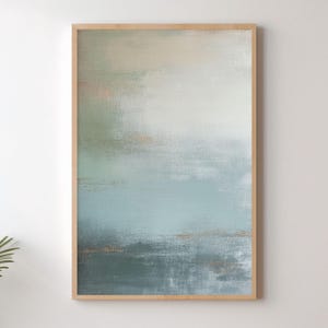 May include: A set of three ceramic mugs with a speckled, matte finish. The mugs are in shades of cream, light gray, and dark gray. Each mug has a simple, minimalist design and a rounded handle.