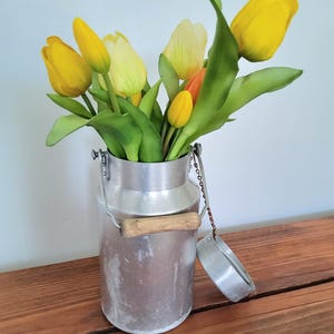 Complete old aluminum milk jug