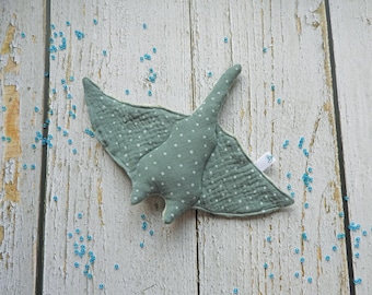 May include: A soft, green and white fabric manta ray toy with a white tag that says "Baby".