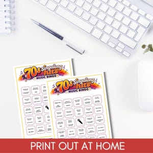 May include: Two white paper bingo cards titled 70s singalong hits MUSIC BINGO with a colorful rainbow graphic, musical notes, and a disco ball. The cards feature a grid of song titles and artist names, with one square showing a black microphone icon.