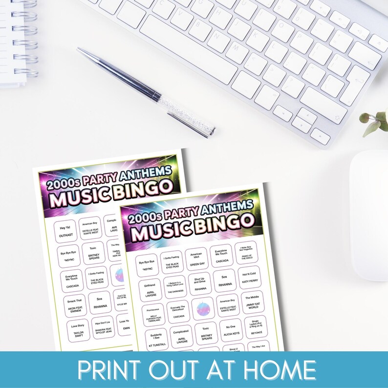 May include: Two "2000s Party Anthems Music Bingo" game cards are displayed with a keyboard, pen, and mouse in the background. The cards have a colourful design with song titles and the text "Print Out At Home".