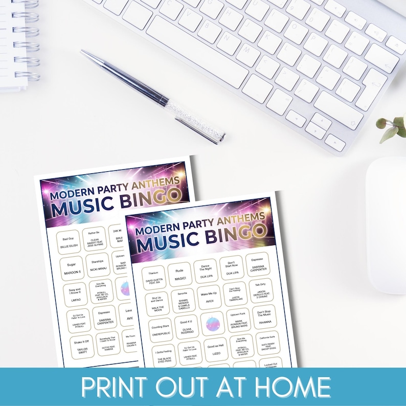 May include: Two "Modern Party Anthems Music Bingo" game sheets with song titles and artist names. The sheets are white with a colorful design and the text "Print Out At Home" at the bottom. A keyboard, pen, and mouse are in the background.