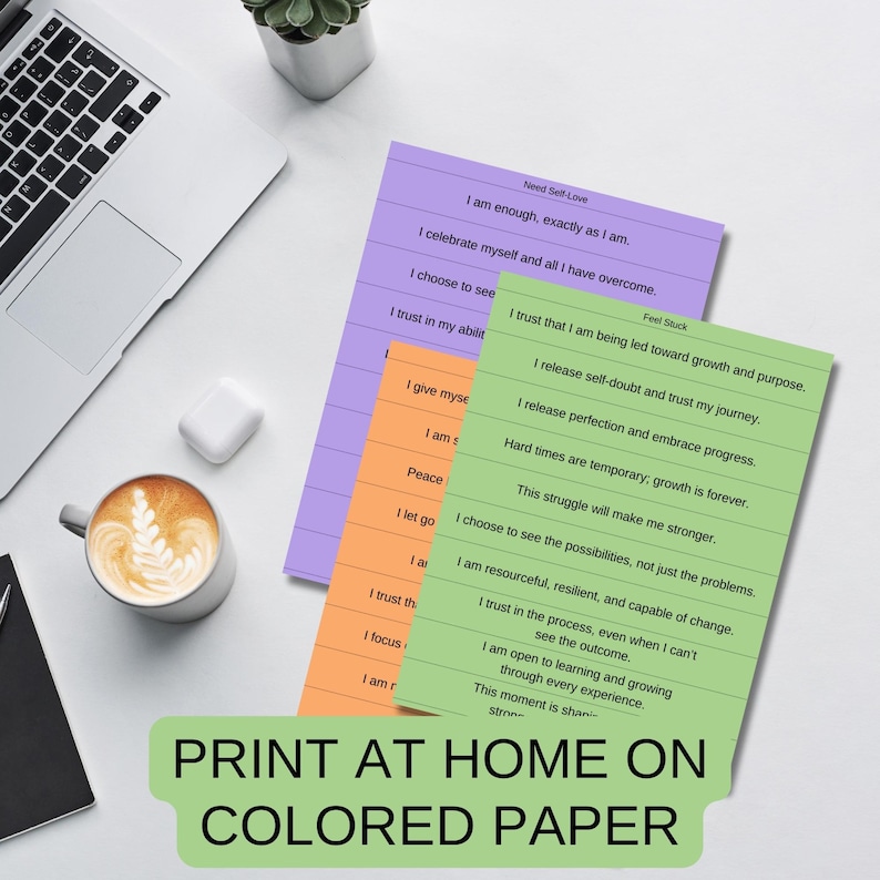 May include: Three printable affirmation cards on different colored paper. The cards are green, purple, and orange. The text on the cards includes positive affirmations about self-love and overcoming challenges.