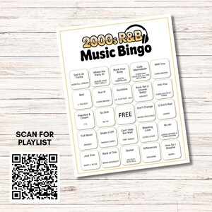 May include: A white 2000s R&B Music Bingo game card with song titles and artist names. The card includes a QR code to scan for a playlist. The card is on a light wood grain surface.