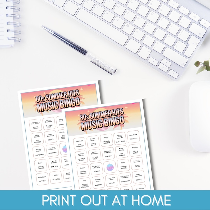 May include: Two 80s Summer Hits Music Bingo game sheets with a sunset design, a keyboard, a pen, and a computer mouse on a white desk. The text "PRINT OUT AT HOME" is at the bottom.
