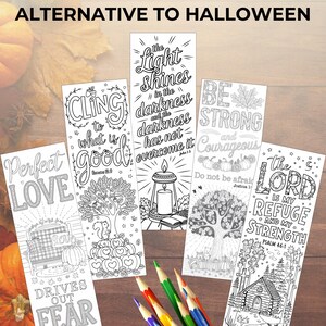 May include: Five black and white printable bookmarks with fall-themed illustrations and inspirational quotes. The bookmarks feature a tree, a candle, a house, and pumpkins. The quotes include "The light shines in the darkness and the darkness has not overcome it", "Cling to what is good", "Perfect Love drives out fear", "Be strong and courageous. Do not be afraid", and "The Lord is my refuge and my strength".