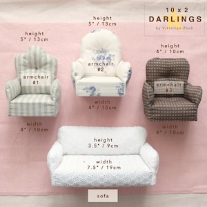 May include: A selection of miniature furniture, featuring three armchairs and a sofa. The armchairs showcase diverse patterns and colors, with a height of 10 to 13 cm. The white sofa, with a lace design, is 19 cm wide.